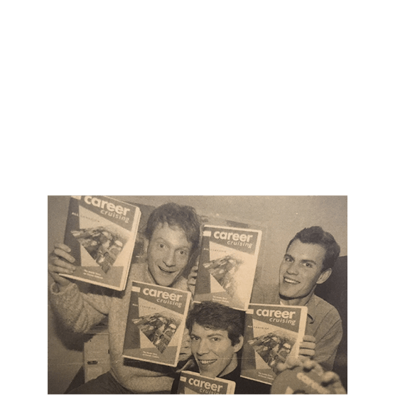 Company founders holding the first version of Career Cruising